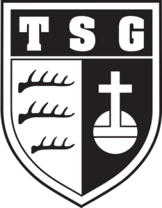 Hier sehen sie das TSG Schwerathletik Logo, es ist ein Wappen mit der Überschrift TSG darunter links 3 Geweihe untereinander auf hellem Hintergrund und rechts ein Kreuz mit einer Kugel auf schwarzem Untergrund